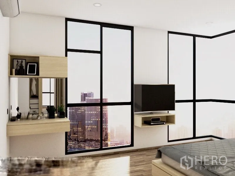 Condominium for rent or sale in Watthana, Bangkok - Bedroom corner with floor-to-ceiling windows showing Bangkok city view, wall-mounted TV, and a vanity desk.
